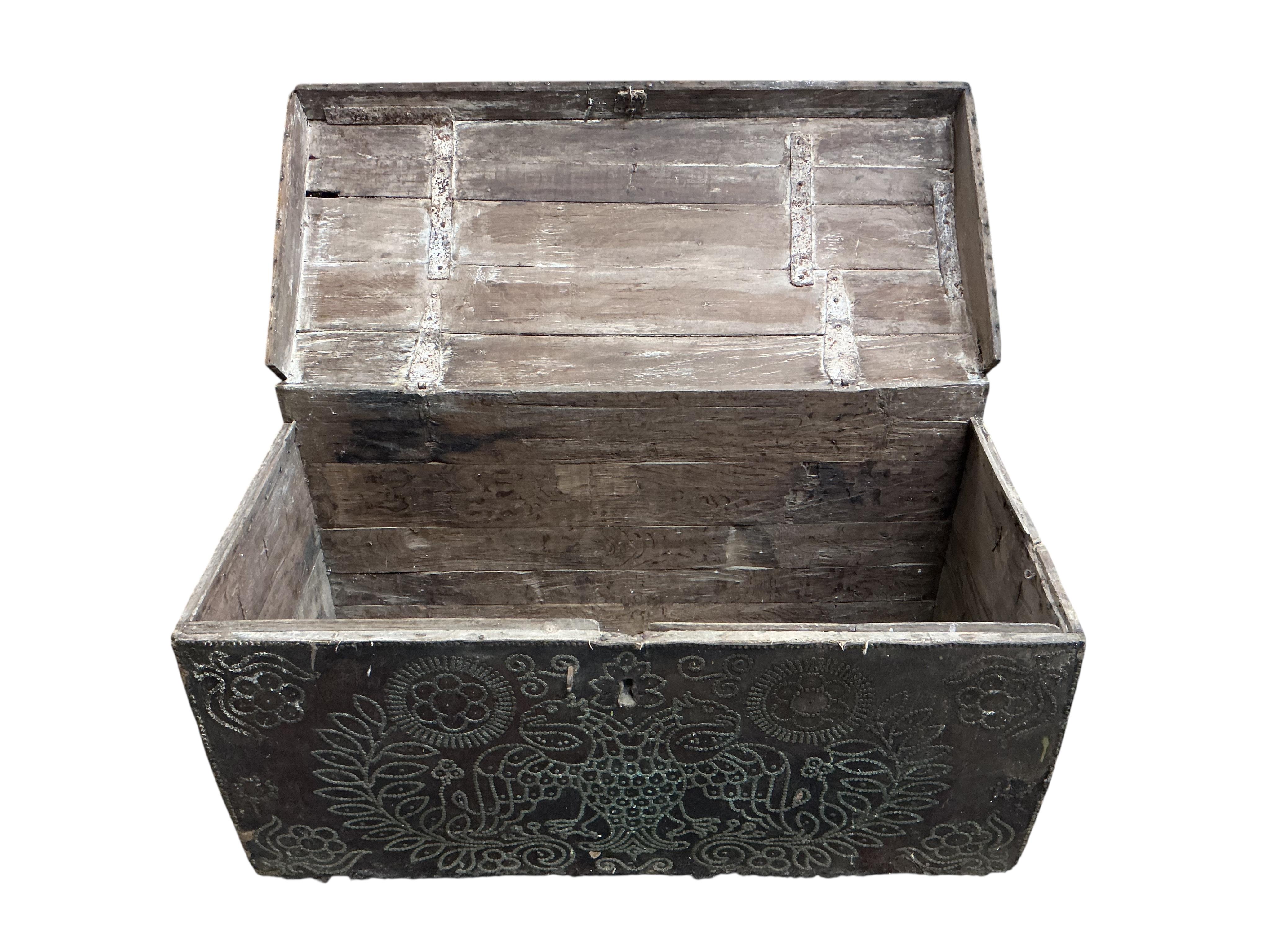 An 18th century oak domed trunk the front with the remnants of studded leather work, width 118cm, depth 53cm, height 65cm